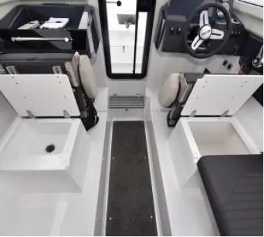 Interior of a modern boat showcasing dual storage compartments, a steering wheel, and two cushioned seating areas.